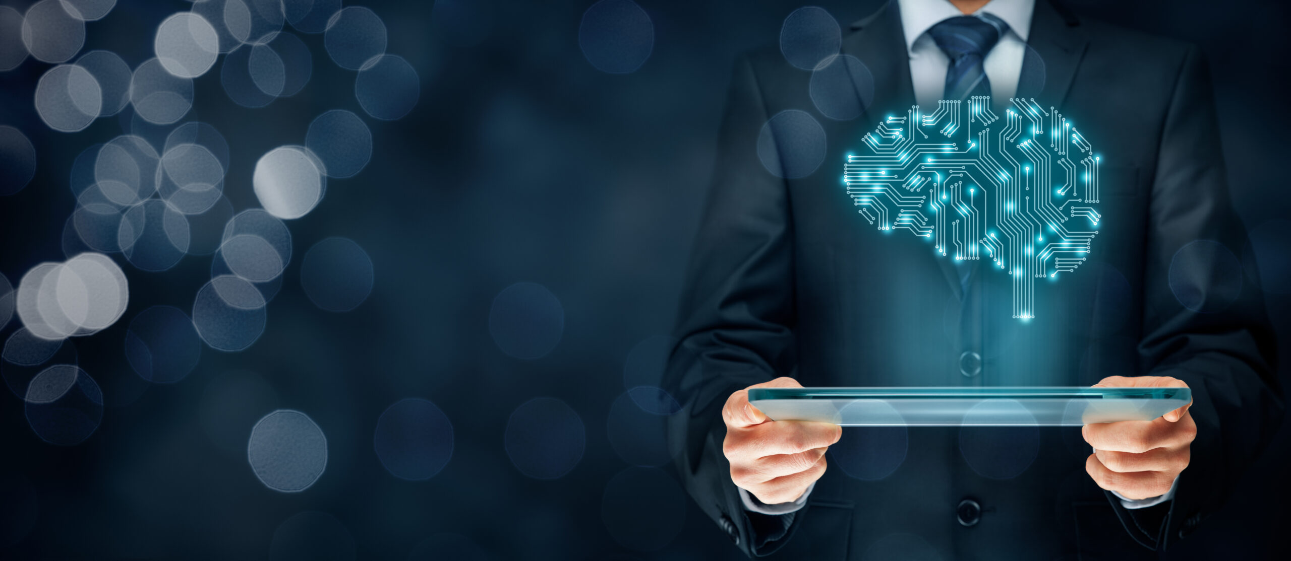 Man holding a tablet with a futuristic holographic brain that represents artificial intelligence.